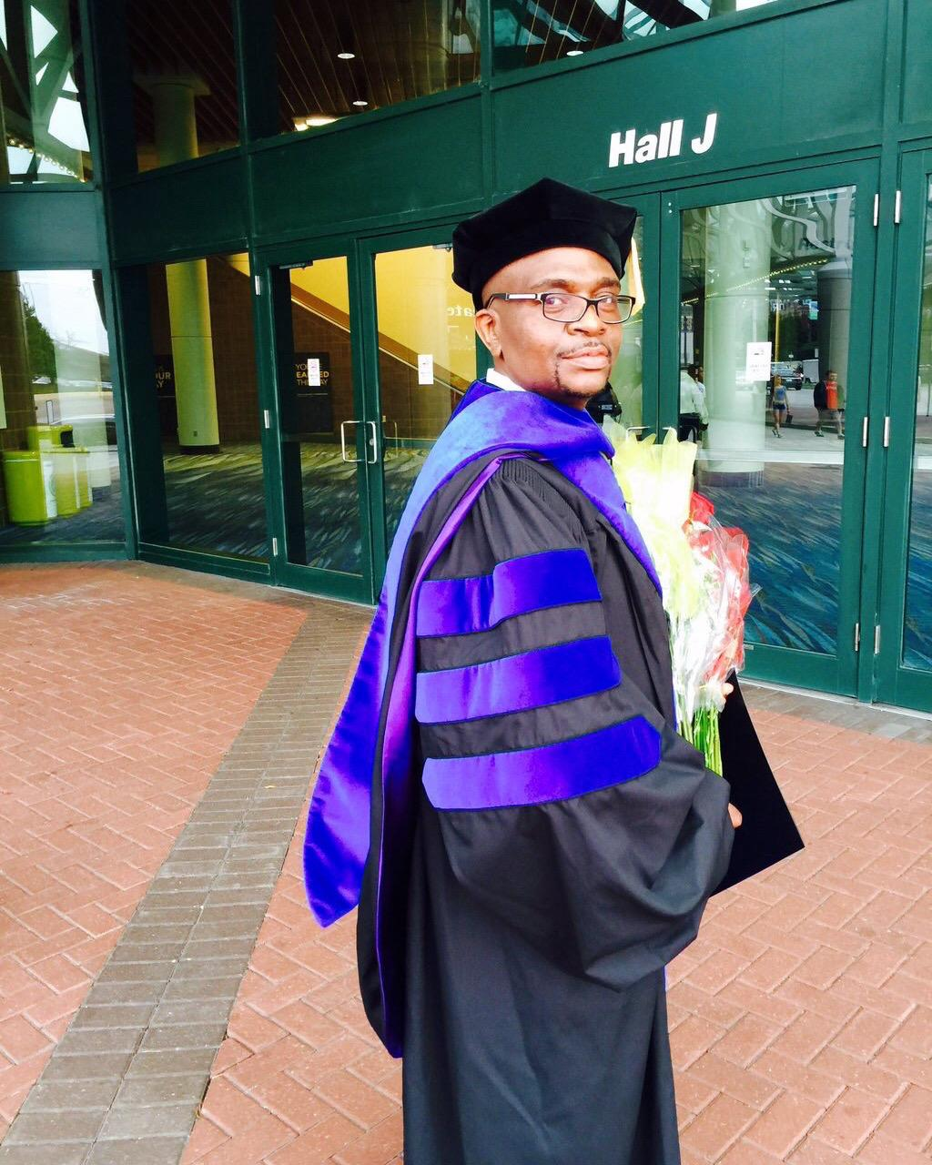 Dr. Martin Tanwie Fonjong in doctoral regalia at his graduation